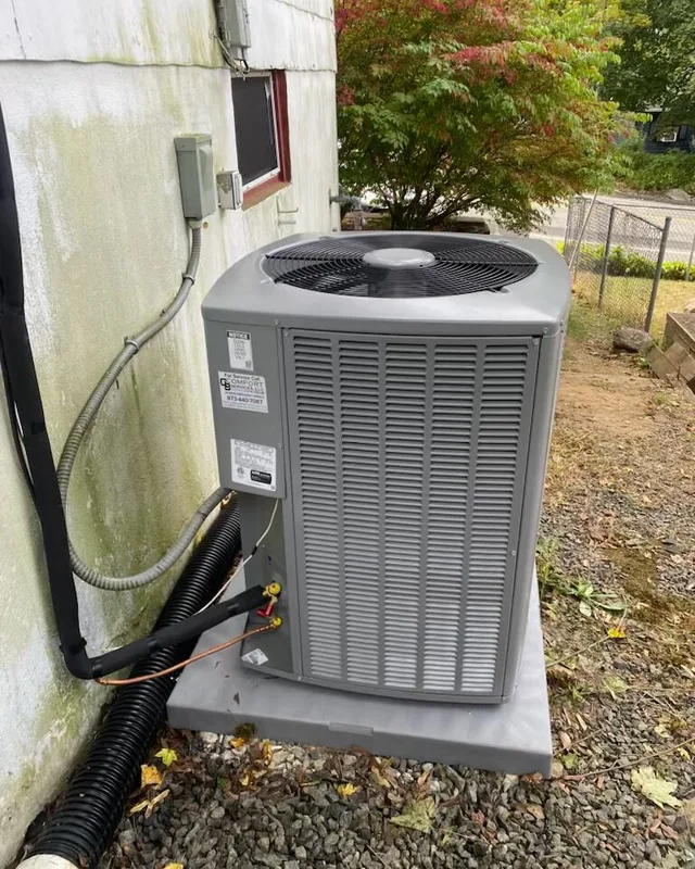 Central air conditioning condenser serviced by GB Comfort Services in Jefferson Township, NJ