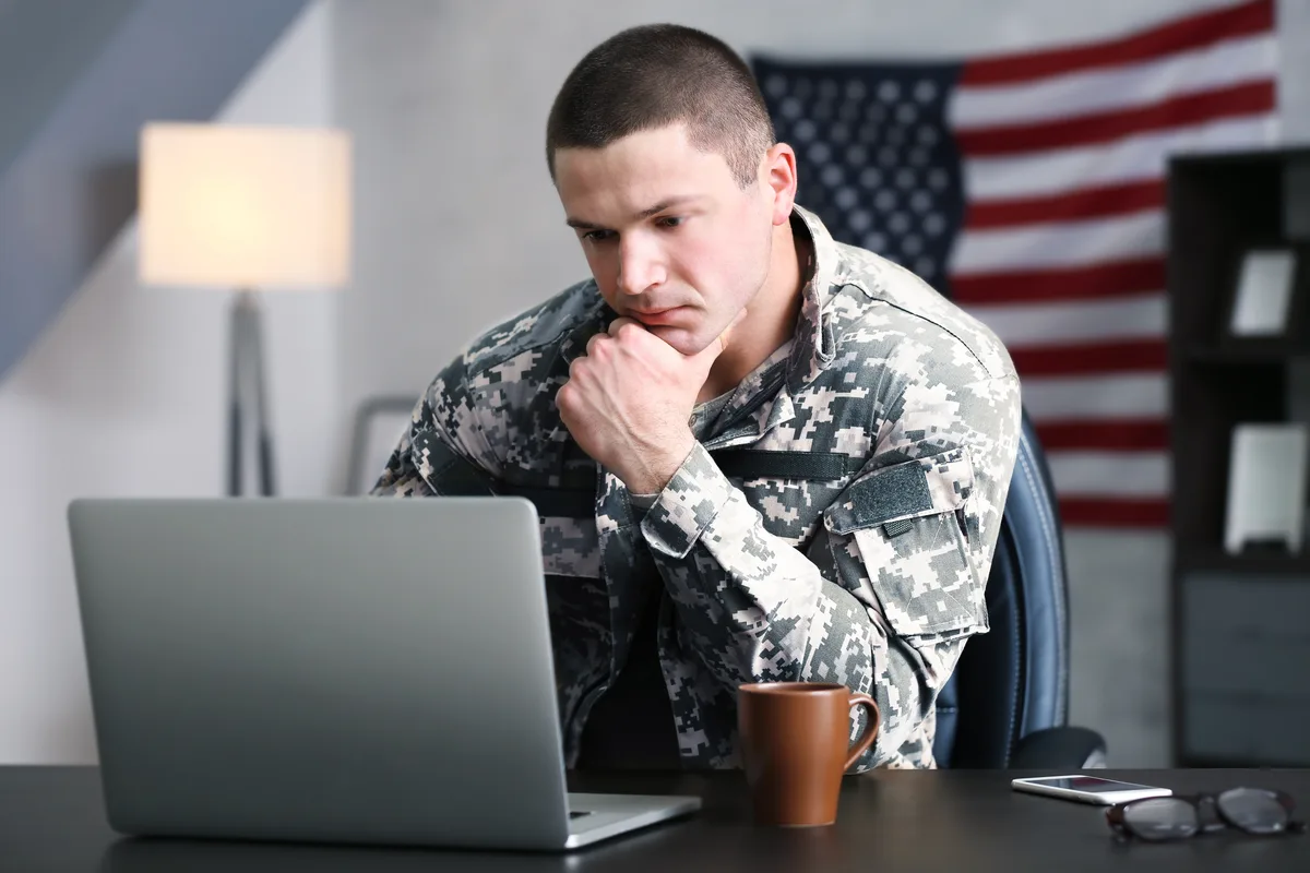 Active-duty service member working at home